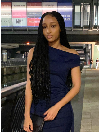 A person in a blue dress

AI-generated content may be incorrect.