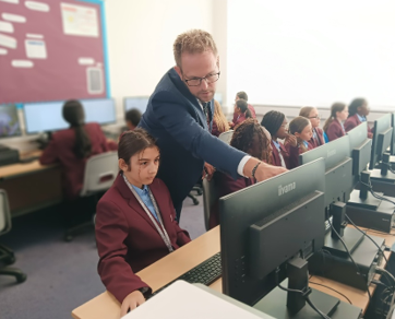 A person and a child in a classroom

AI-generated content may be incorrect.